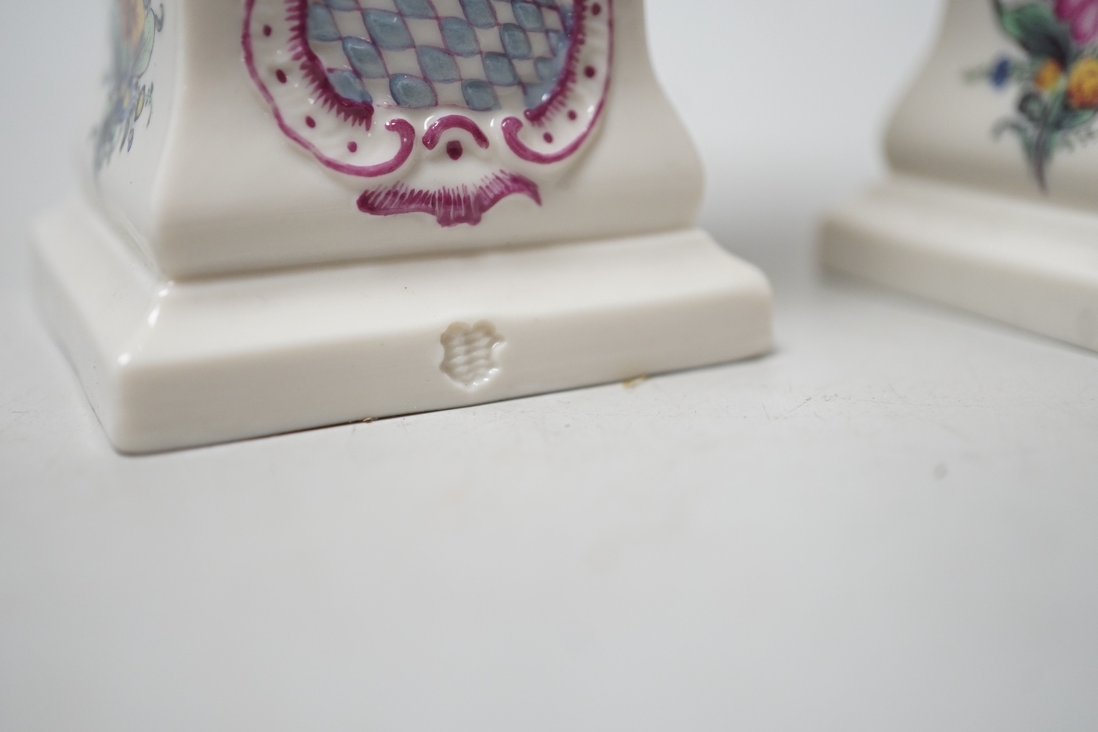 A pair of Nymphenburg urns, marked to base. 15.5cm tall